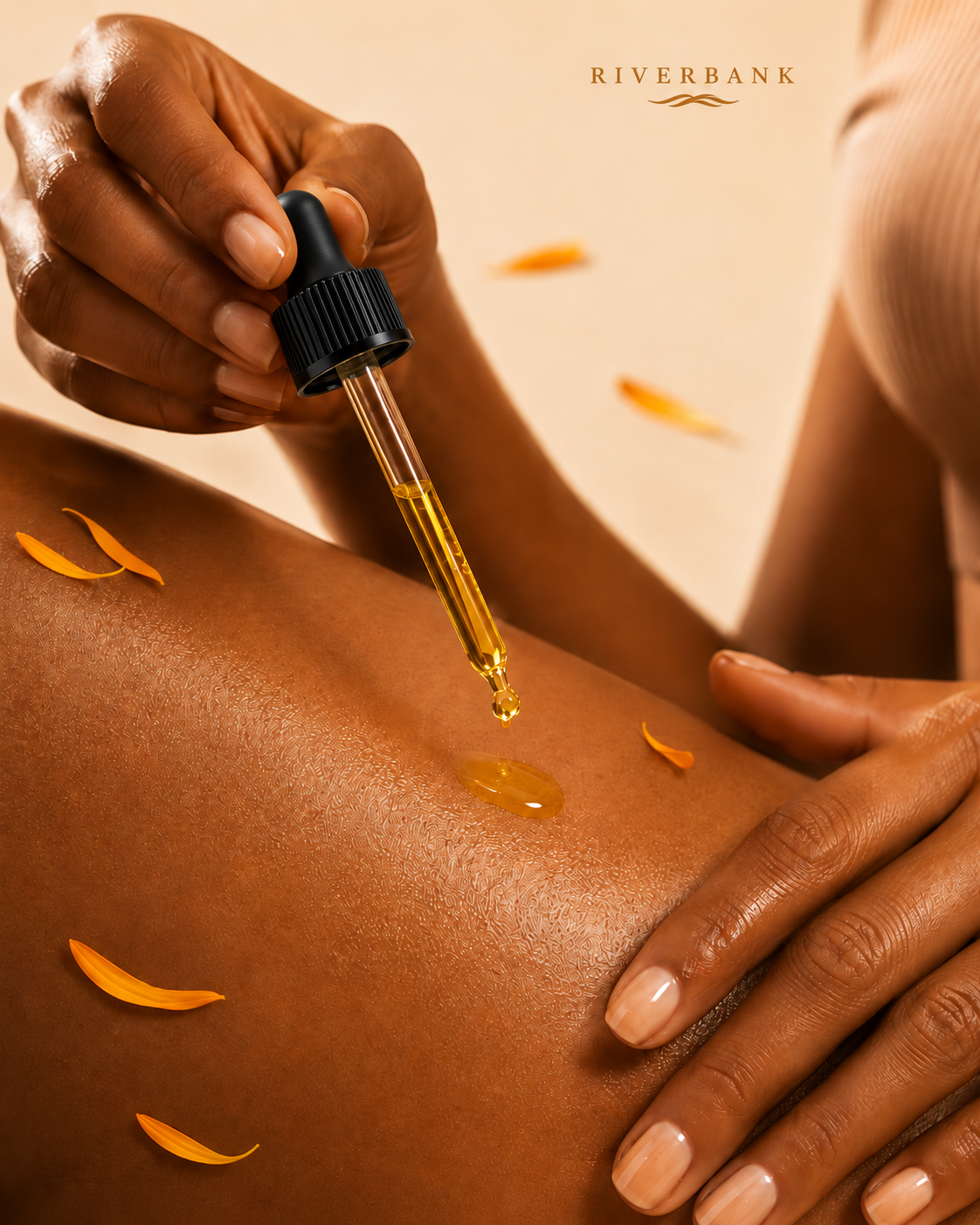 RIVERBANK body oil being applied to the shoulder, with calendula petals